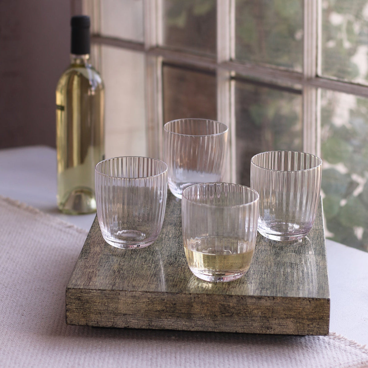 beatriz-ball-wholesale-glass-audrey-stemless-flute-with-gold-rim-set-of-4-clear-and-gold