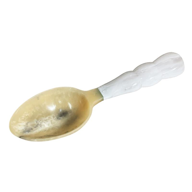 Resin ice scoop with a white handle on a white background